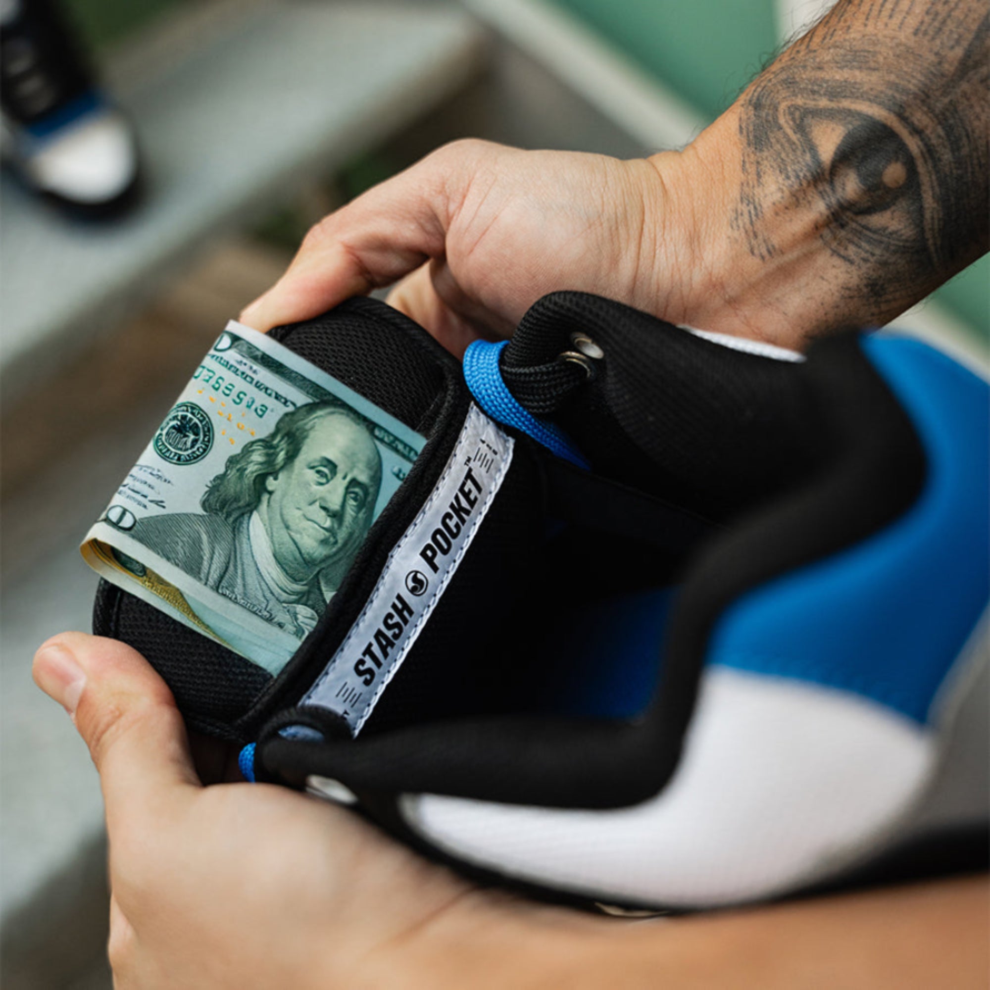 Close-up of the hidden stash pocket inside the tongue of the DVS Enduro Heir skate shoe.
