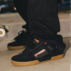 A three-panel collage showing a man wearing black skate shoes with tan and brown gum soles, including a close-up of the shoes, a photo of him sitting in a car window, and a full-body shot of him skateboarding outdoors.