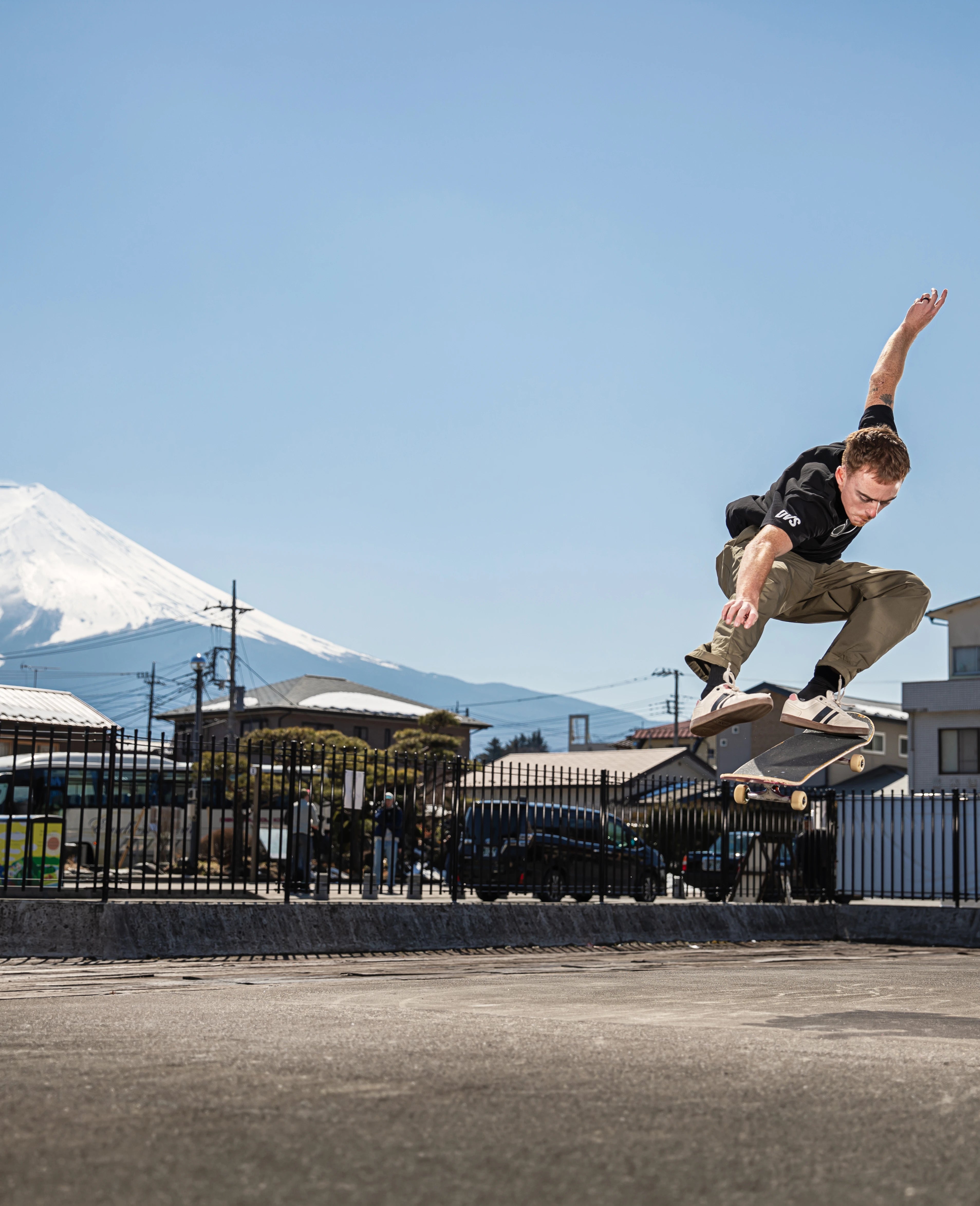 Skateboarder performing a trick with Mount Fuji in the background